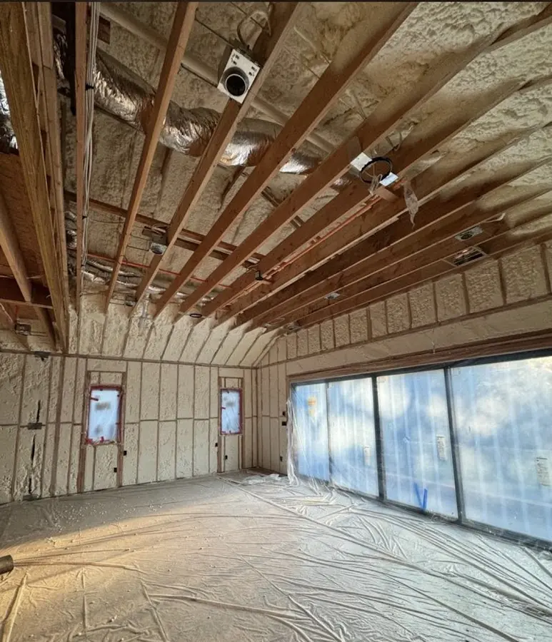 Interior walls and ceiling insulated with spray foam during new construction in Northborough